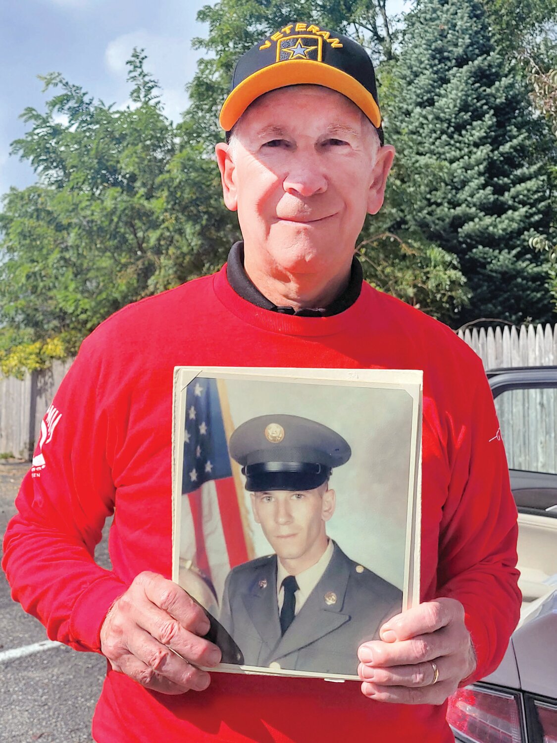 WELCOME HOME REDUX: Retired U.S. Army Corp. Mario DeAngelis grew up in Providence, lived in Cranston for decades, and recently settled in Johnston. He holds a photo from his time in the service during the Vietnam War.